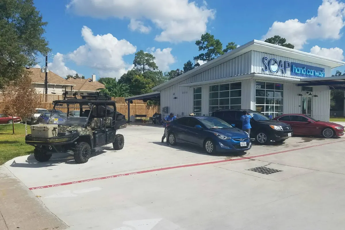 SOAP Hand Car Wash lot with customers vehicles