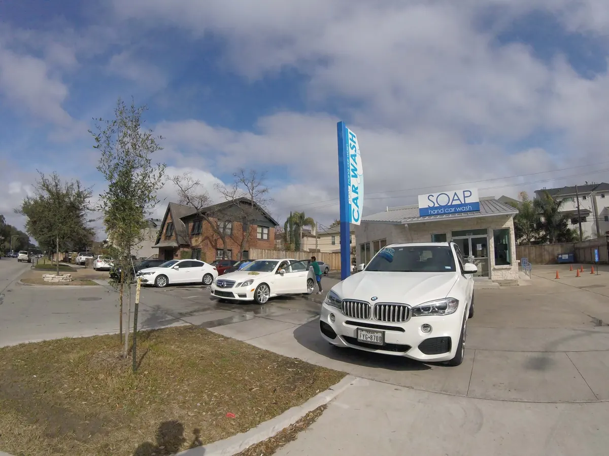 White BMW X5 at a SOAP Hand Car Wash location